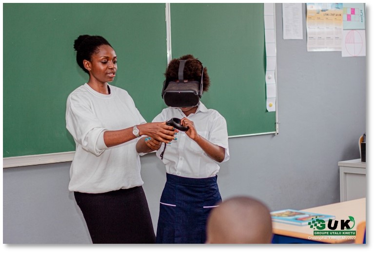 Woman with student using VR headset
